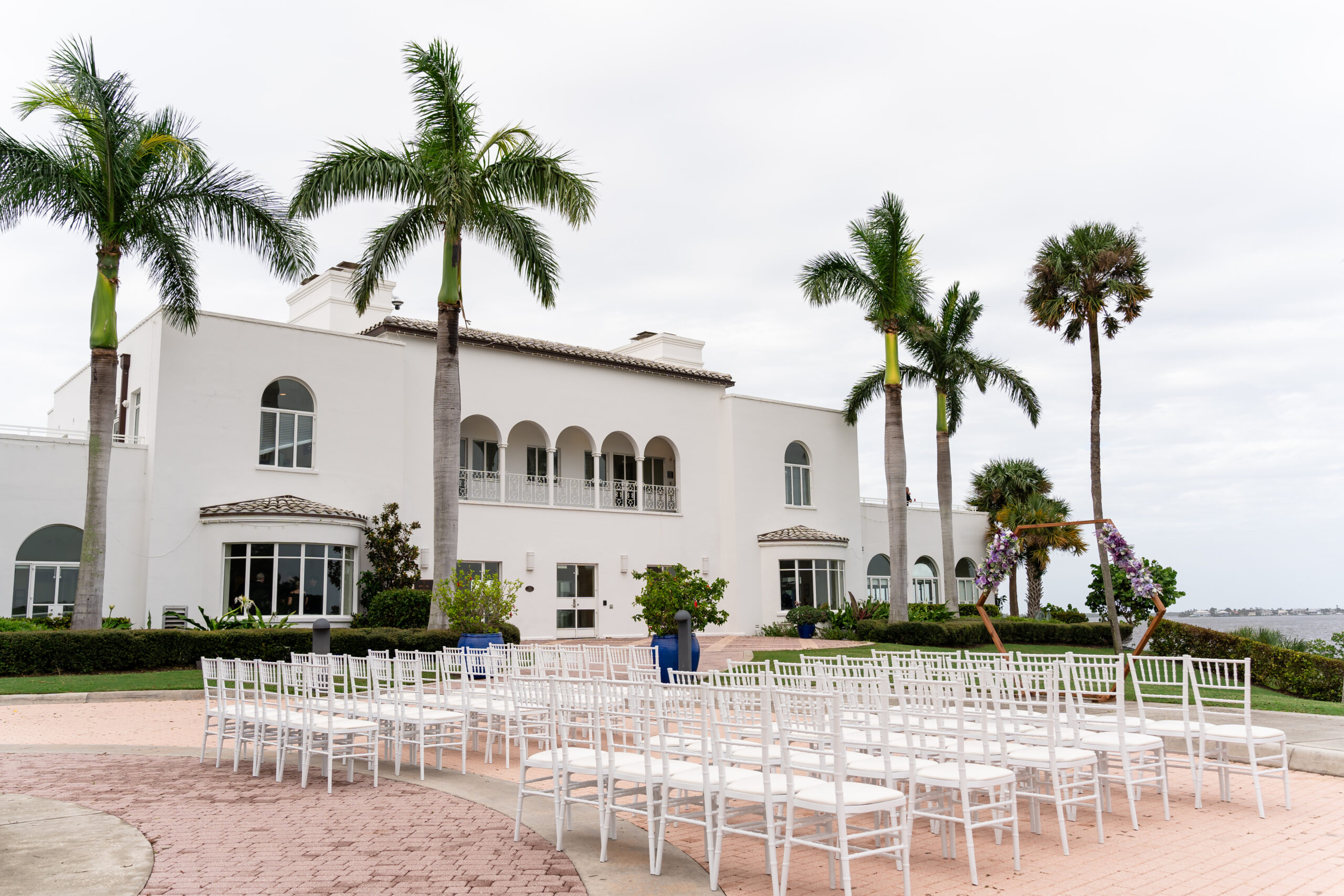 Mediterranean-style estate wedding at The Mansion at Tuckahoe, showcasing the historic white mansion and waterfront ceremony views captured by Dear Magnolia Films.